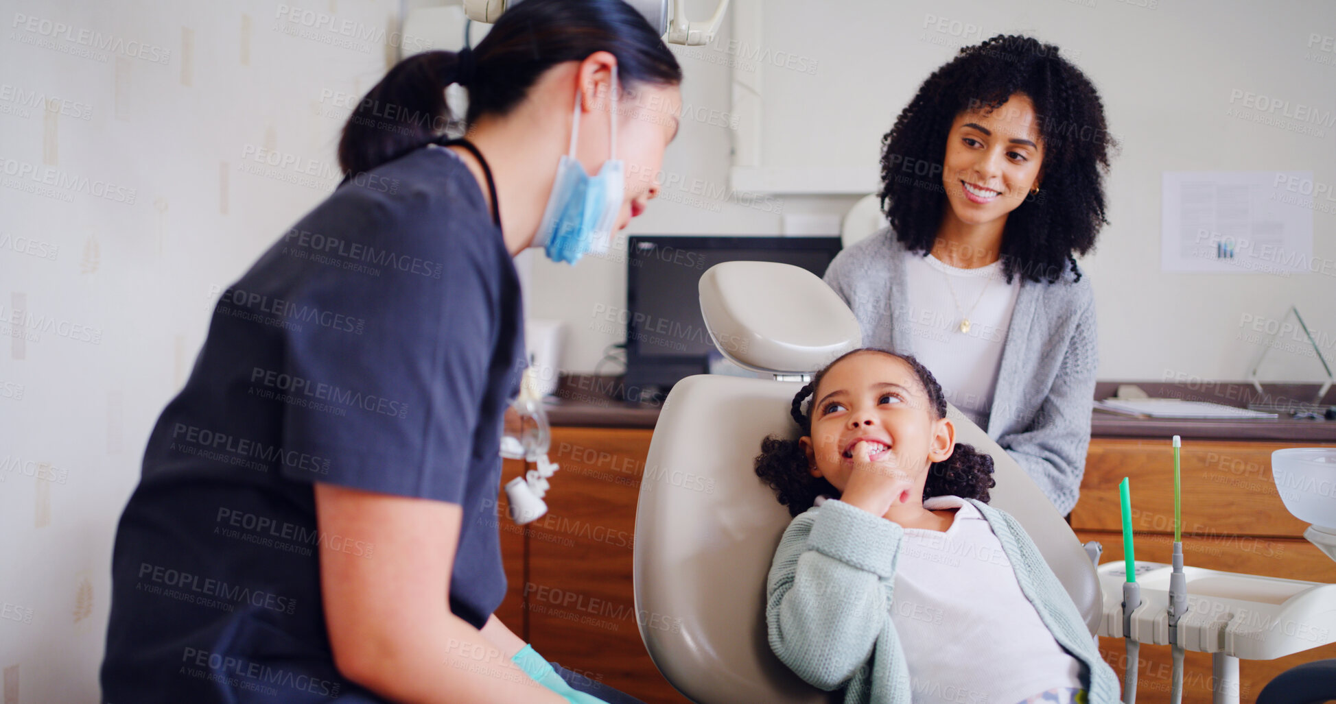 Buy stock photo Child, smile and dentist for consultation with discussion, oral hygiene and mouth cleaning service. Mother, health professional and orthodontic inspection for dental care with patient for checkup