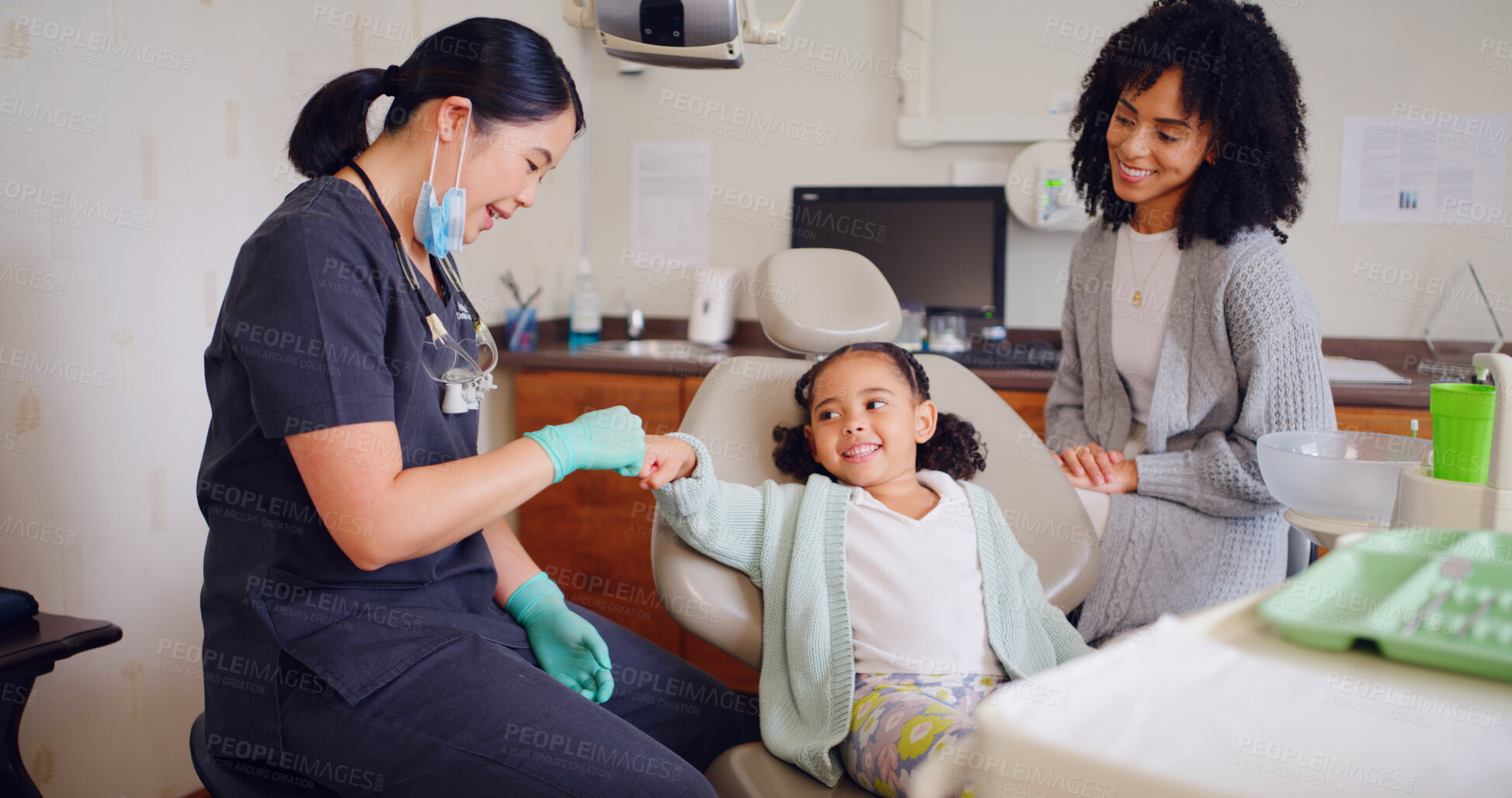 Buy stock photo Child, fist bump and dentist for consultation with discussion, oral hygiene and mouth cleaning service. Mother, health professional and orthodontic inspection for dental care with girl for checkup