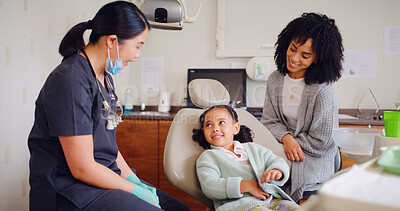 Buy stock photo Girl, smile and dentist for consultation with discussion, oral hygiene and mouth cleaning service. Mother, health professional and orthodontic inspection for dental care with child for checkup