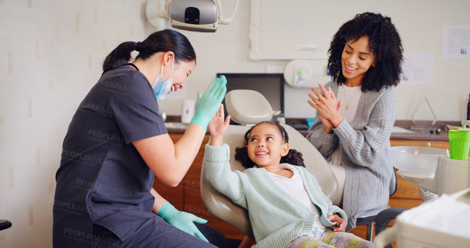 Buy stock photo Child, high five and dentist for consultation with discussion, oral hygiene and mouth cleaning service. Mother, health professional and orthodontic inspection for dental care with girl for checkup