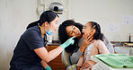 Dentist, mother and child in consultation with inspection for oral hygiene, healthcare or wellness. Dental hygienist, mom and daughter in office for mouth examination, medical assistance or pointing.