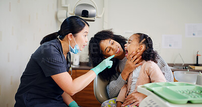 Buy stock photo Dentist, mother and child in consultation with inspection for oral hygiene, healthcare or wellness. Dental hygienist, mom and daughter in office for mouth examination, medical assistance or pointing.