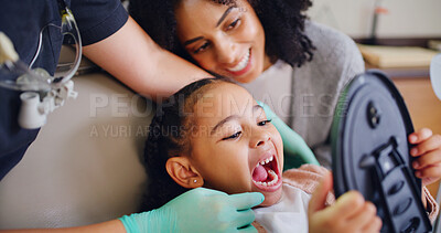Buy stock photo Dentist, mother and child in consultation with mirror for teeth cleaning results, healthcare or wellness. Dental hygienist, mom and daughter in clinic for mouth check, oral hygiene and satisfaction.