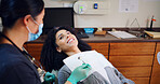 Dental, consultation or woman in clinic with smile, advice or examination for decay prevention. Healthcare, guidance or dentist in hospital with tools, checkup or mouth inspection  for oral health.