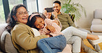 Happy family, playing and home with child on sofa for fun childhood, love or care together. Mom, dad and grandma with smile, kid or granddaughter for weekend, holiday or bonding on couch in house