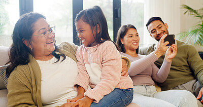 Buy stock photo Happy family, bonding and playing with child on sofa for fun childhood, love or care in home. Mom, dad and grandma with smile, kid or granddaughter for weekend, holiday or relax on couch in house