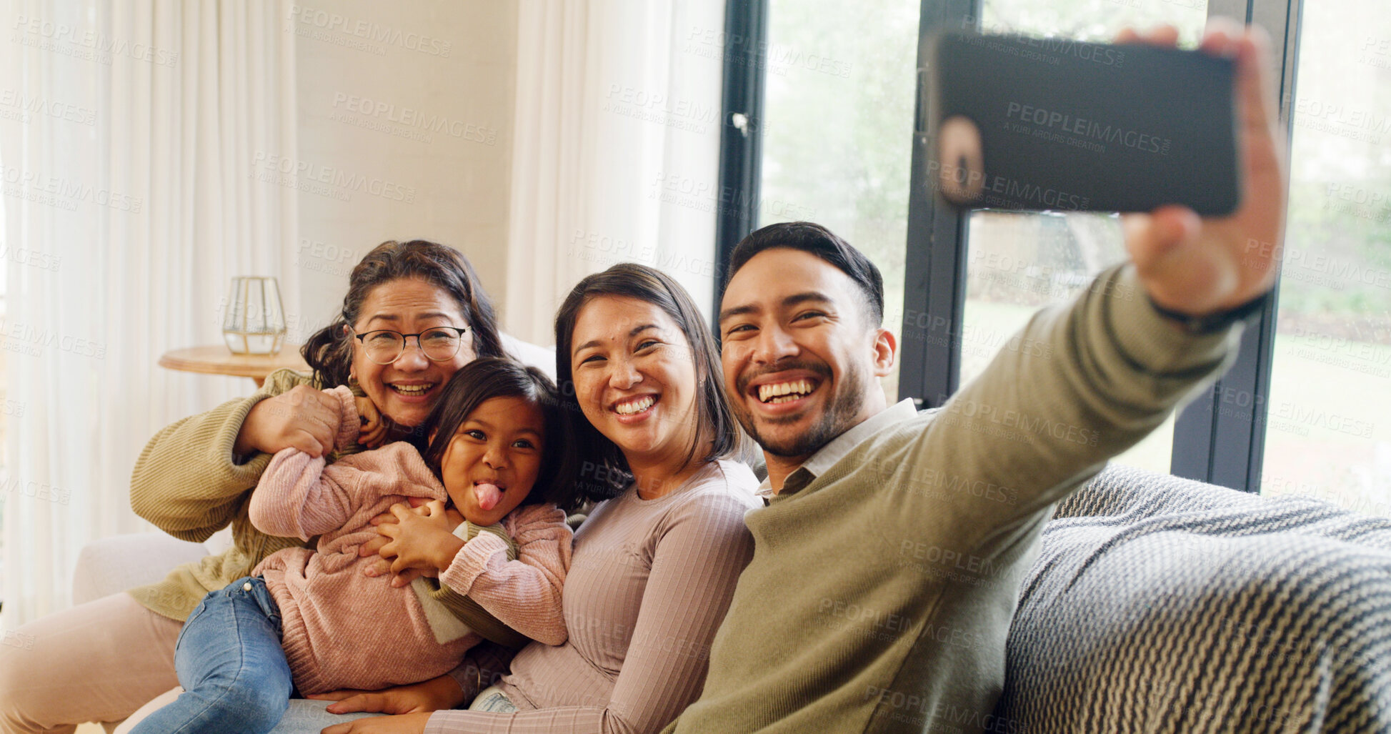 Buy stock photo Portrait, grandma and parents with child, selfie and bonding in living room, happy and memory on web. Laughing, grandparent and people with girl in house, photography and picture for social media