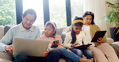 Buy stock photo Old people, browsing and children with tech, lounge and help for video selection on web and together. Streaming, movies and elderly woman with tablet in home, grandparents and bonding with family