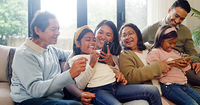 Buy stock photo Happy, phone and big family on sofa in home for bonding, connection and love on weekend together. Laugh, cellphone and children with grandparents and parents in living room for development in house.