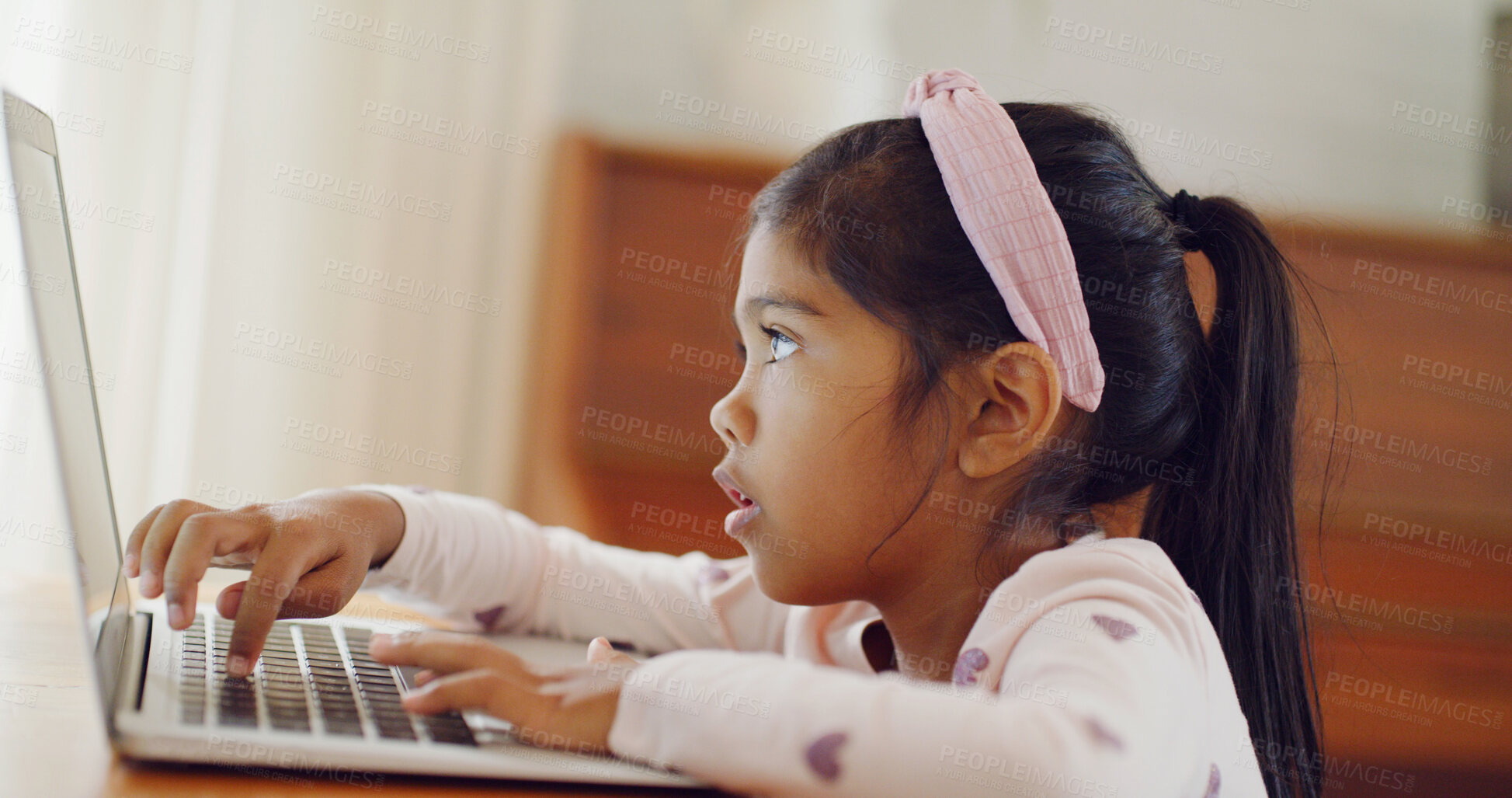 Buy stock photo Typing, curious or child in house with laptop, testing or digital skills in cognitive learning. Online, interactive or girl in home with pc, practice or tech activity in childhood development.