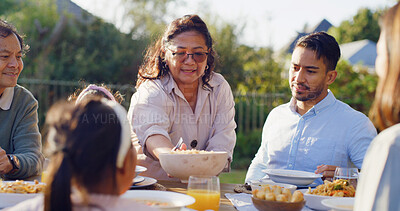 Buy stock photo Serving, generations or Asian family at table with meal, bonding together or reunion in healthy relationship. Grandparents, parent and child outdoor with feast, connection or shared food in tradition