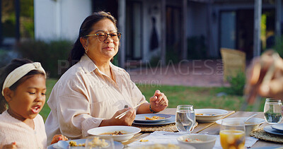 Buy stock photo Smile, grandmother or child in backyard with meal, bonding together or reunion in healthy relationship. Love, social and Asian family at house with feast, connection or shared food in tradition.