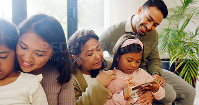 Buy stock photo Happy family, smartphone gaming and girls on couch, internet and bonding together with help. Home, grandparent and mother with father, kids and cellphone with online contest, esports and competition