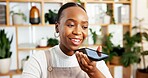 Phone call, plant or black woman in office on speaker, client chat or negotiation on sustainable material. Happy, networking or eco consultant in agency with tech, outreach or discussion on ESG goal.