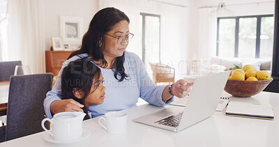 Buy stock photo Search, laptop and grandmother with girl for steaming, cartoon and movies choice. Bonding, tech and weekend with elderly woman and granddaughter in living room of home for relax, website and internet