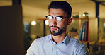 Man, computer and night at startup with project, proposal review and glasses at media company. Person, journalist and overtime with pc, insight and editing process with article at creative agency