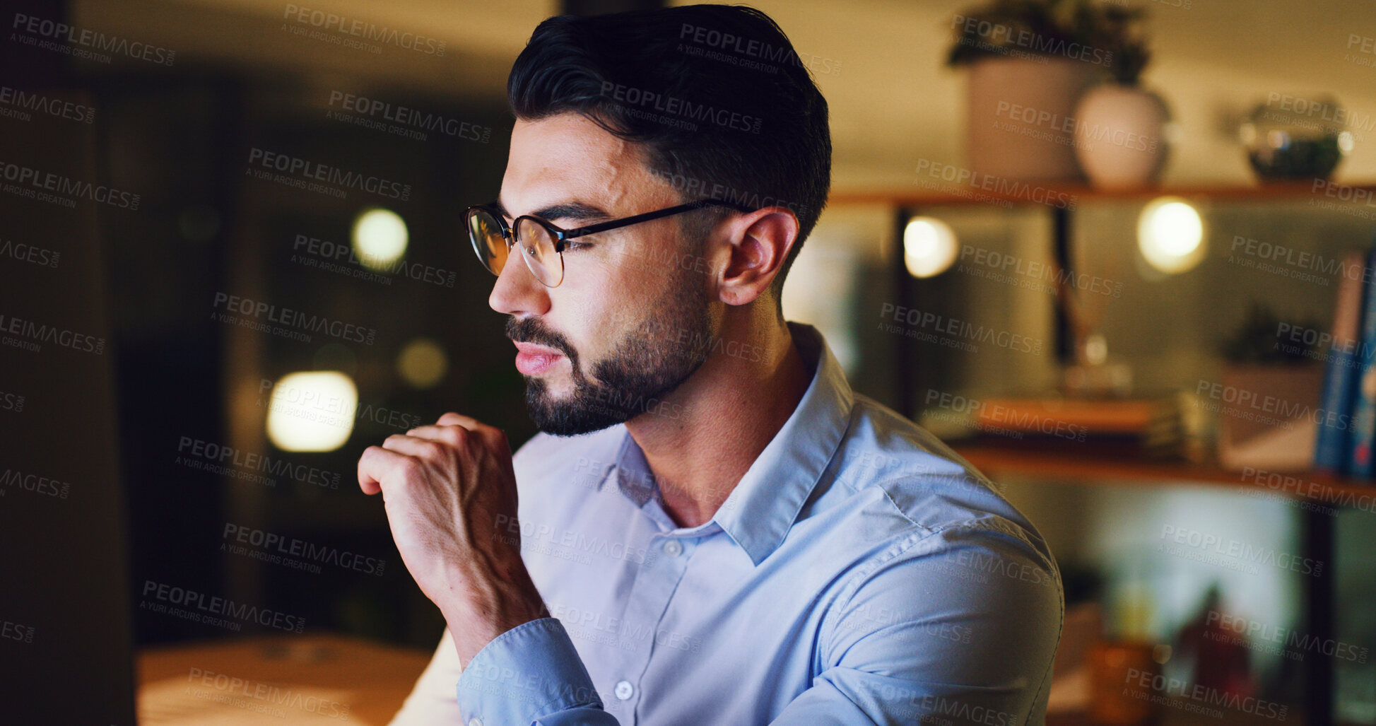 Buy stock photo Computer, man and reading at desk at night for blog review, proofreading story and fact checking. Bokeh, editor and tech at media agency for editing deadline, source verification and news publication