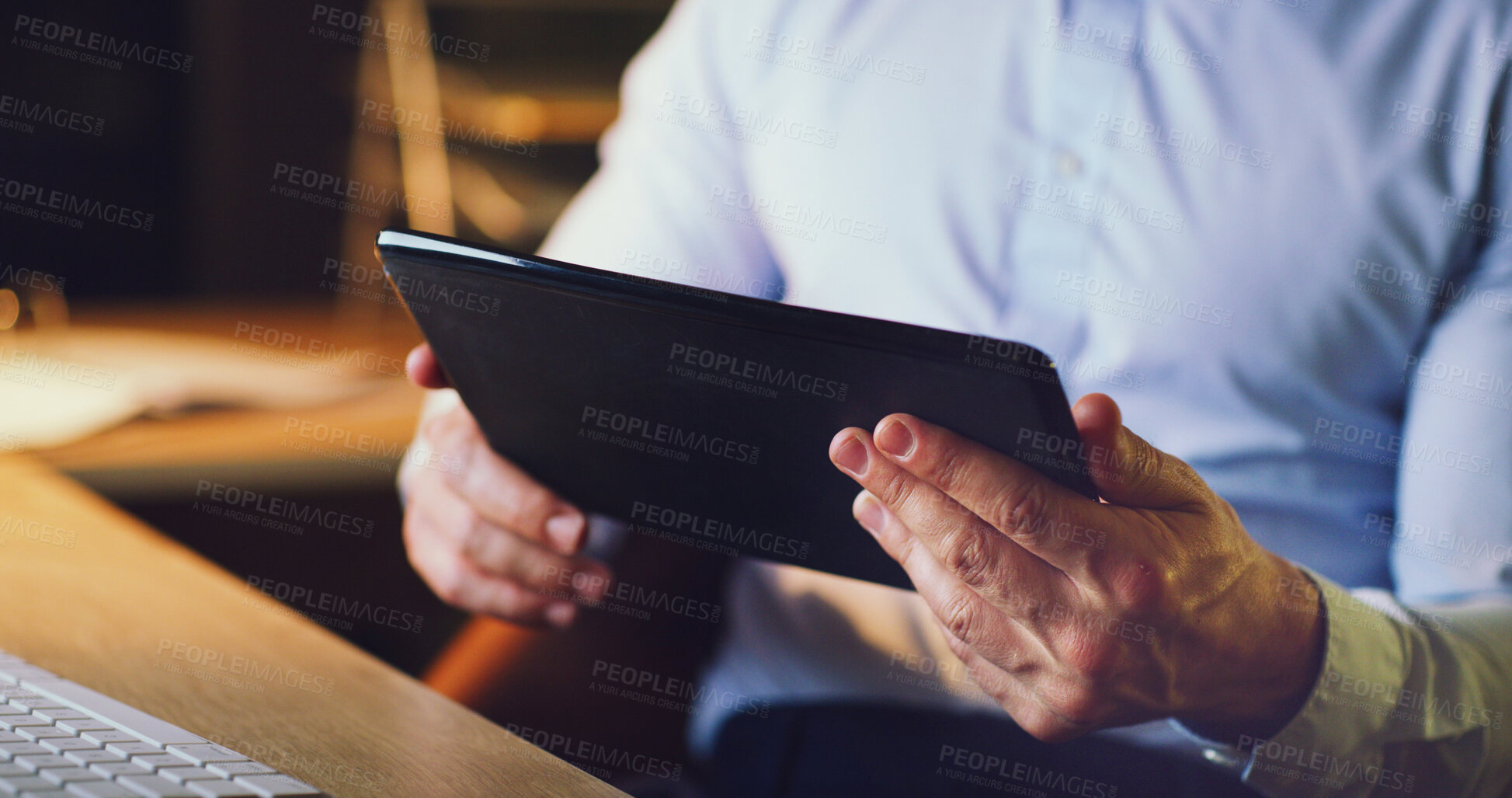 Buy stock photo Businessman, hands and research with tablet in night for schedule or planning in office. Closeup, man or employee working late with technology for online design, project or deadline in workplace