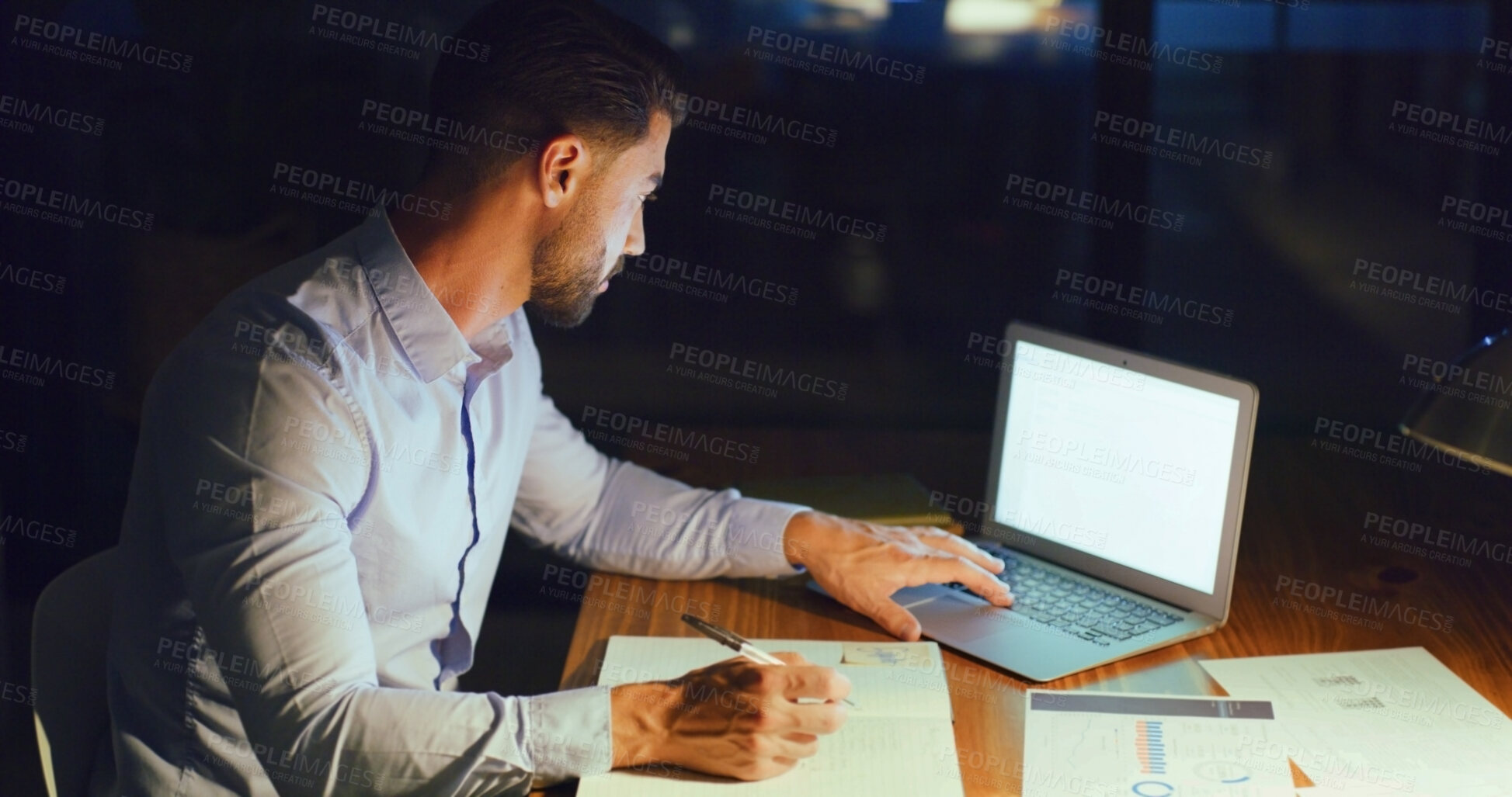 Buy stock photo Businessman, notebook and laptop screen at night for trading algorithms, stock price and research. Overtime, trader and tech with mockup space in office for market analysis, growth charts and notes