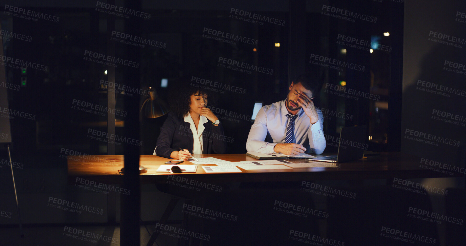 Buy stock photo Woman, man and stress at night in office with documents, team and mistake at investment company. People, review and frustrated with overtime, lost revenue or stock market crash at finance agency