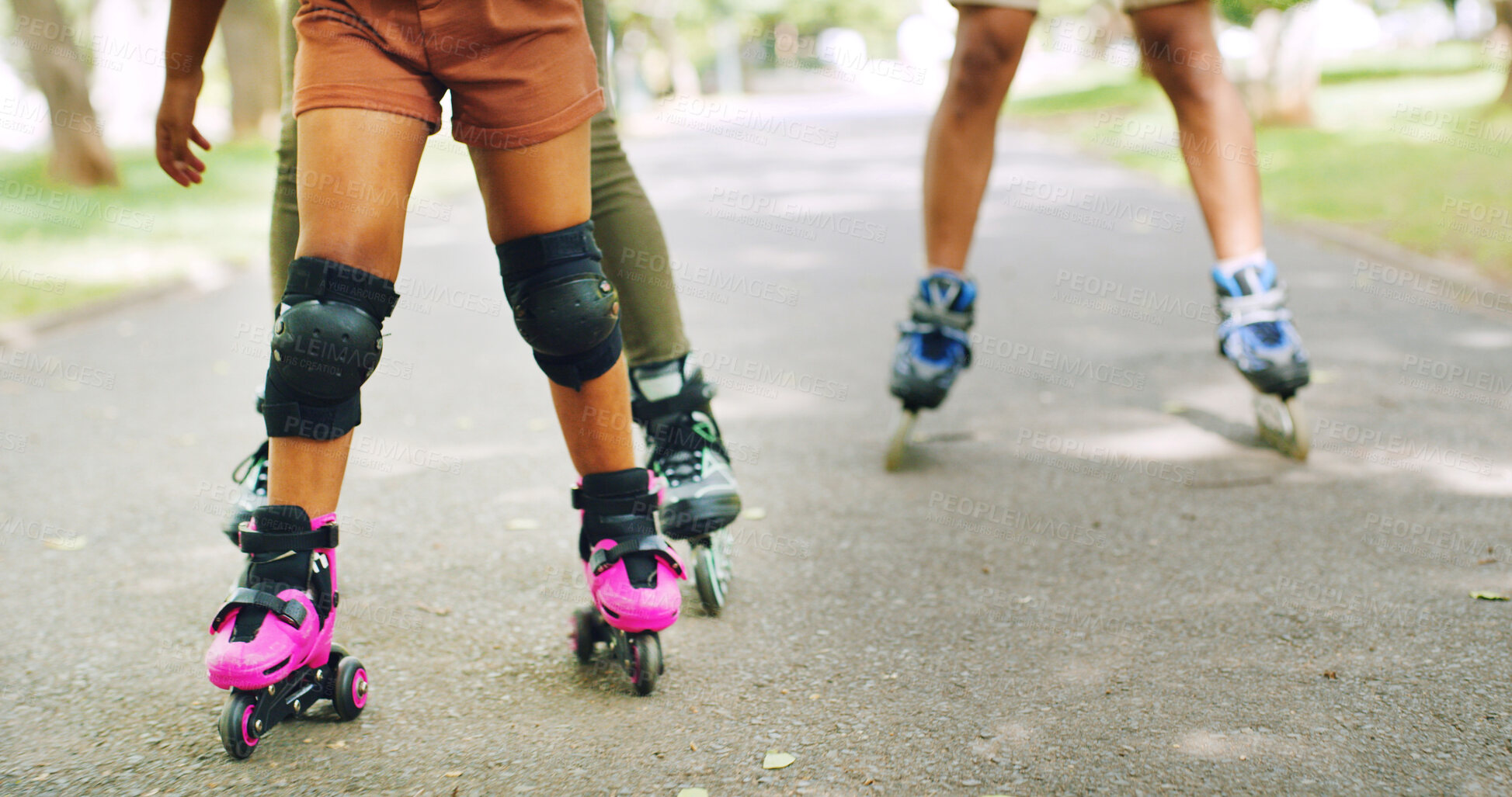 Buy stock photo Rollerskating, legs and family in nature on holiday, getaway or weekend trip with balance. Knee pads, safety and people with skates for hobby or adventure together outdoor in park on vacation.