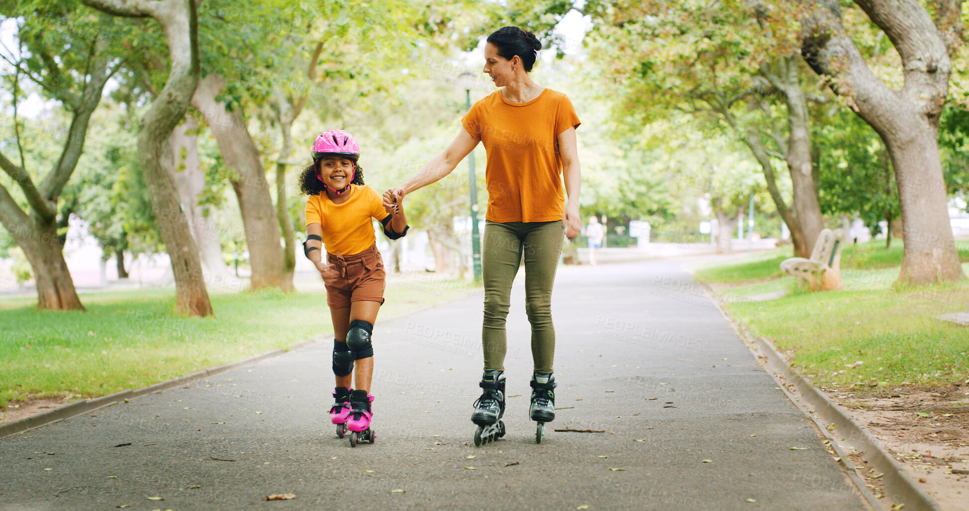 Buy stock photo Roller skating, holding hands and mother with child in nature on holiday, getaway or weekend trip with balance. Happy, safety and mom with kid in skates for hobby together outdoor in park on vacation