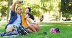 Outdoor, family and funny face for selfie with roller skates, social media post and tongue out. Mom, dad and picture with girl on skating break for goofy memory, smile and interracial people on grass
