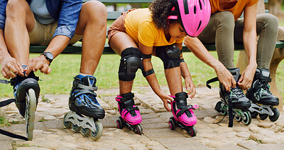 Buy stock photo Rollerblade, parents and girl in park, family and bonding together with hobby. Outdoor, mother or father with daughter, skates or safety with active fun, tying laces or straps with support or helmet