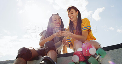 Buy stock photo Phone, roller skating and girl friends at park with laughing for communication, texting or contact. Happy, skate and women with cellphone for social media, chatting or mobile app outdoor from below.