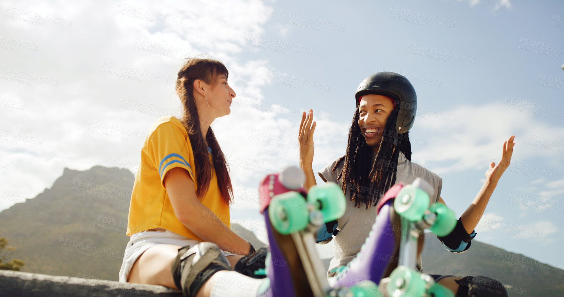 Buy stock photo Skaters, talk and friends on break, outdoor or people with smile for hobby, discussion and low angle. Happy, woman and man with ideas for roller skating technique, conversation or safety with helmets