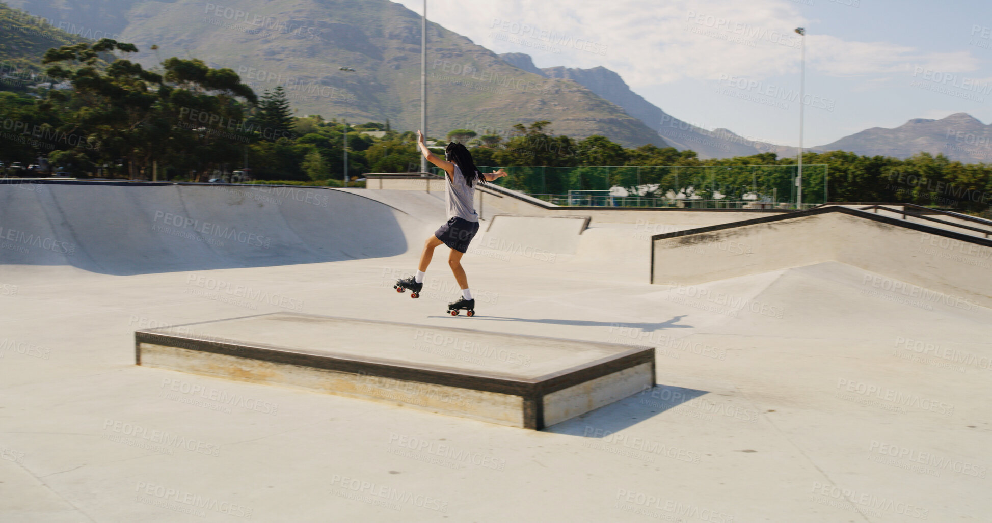 Buy stock photo Skate park, balance or man with headphones on weekend, streaming music or trick practice for hobby. Outdoor, audio tech or person with rollerskate for coordination development, space or radio track