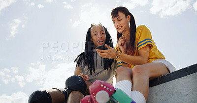 Buy stock photo Friends, chill outdoor and phone with roller skate, website and surprise for viral social media video. Space, people and bonding with tech at skatepark for internet search, connection and low angle.