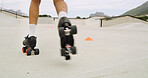 Feet, roller skates and ramp at park with speed, blur and space with balance, skills or ride in summer. Legs, skater and person with exercise, energy and ground for extreme sports training in city