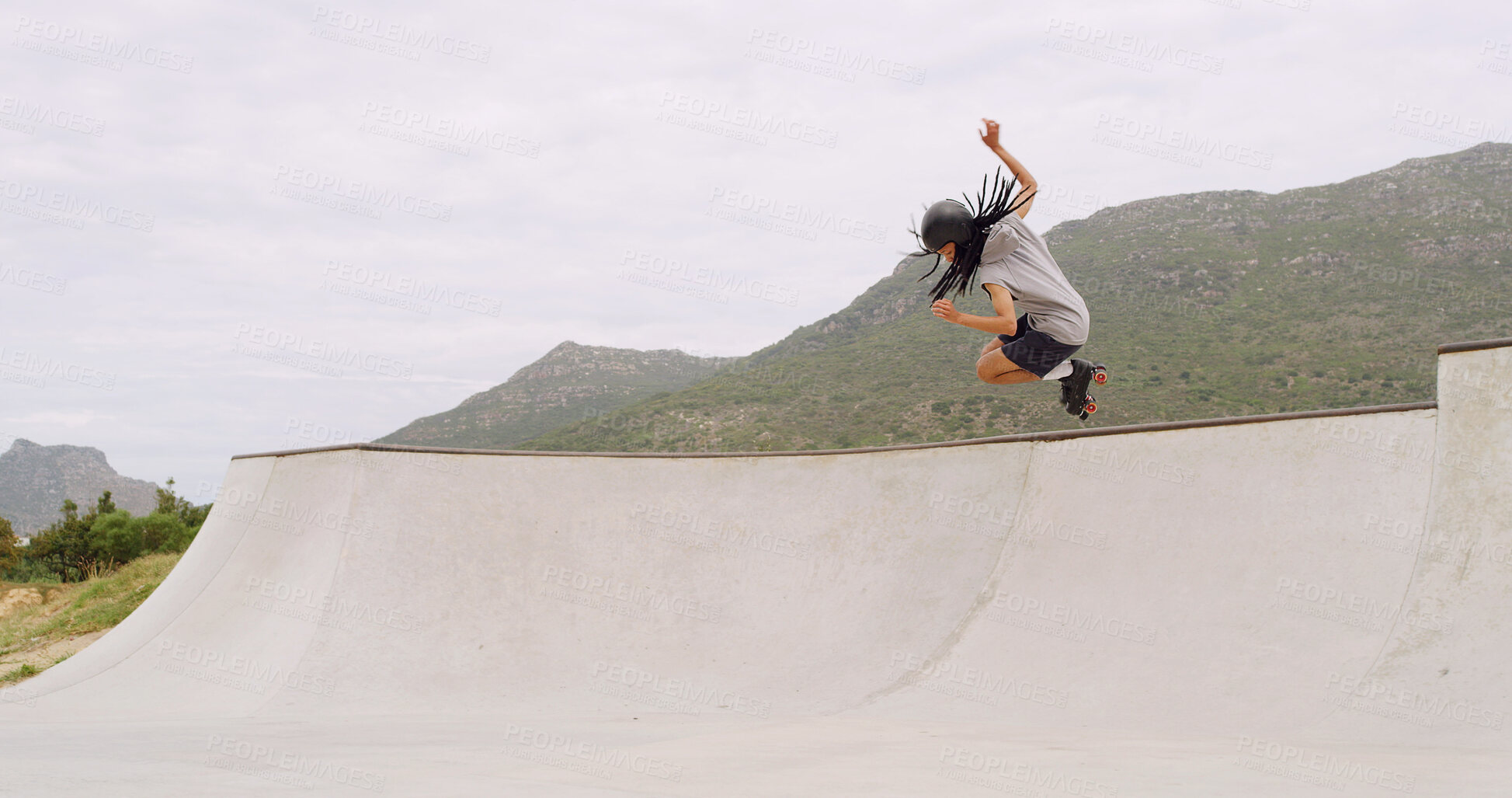 Buy stock photo Man, roller skates and ramp at park with jump, sky and space with speed, skills or stunt in summer. Gen z person, skater and trick with exercise, energy or outdoor for extreme sports training in city
