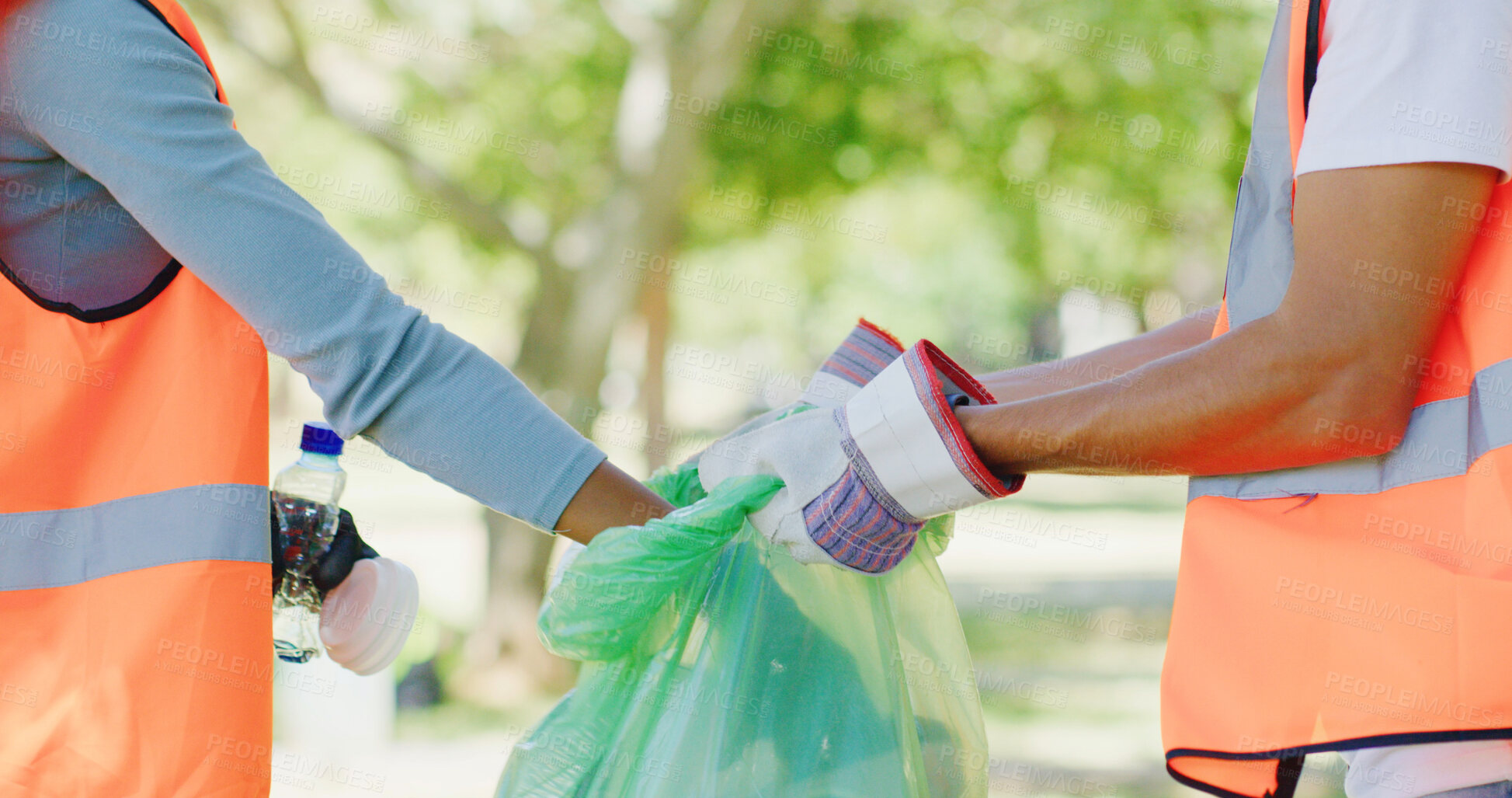 Buy stock photo Volunteer, trash and hands of people in park with bag to collect waste, plastic and litter for pollution. Outdoor, cleaning and person with team for community service, recycling or environmental care