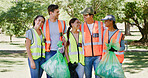 Volunteer, cleaning and portrait of people in park with bag to collect trash, plastic and litter for pollution. Outdoor, team and men and women for community service, recycling and environmental care