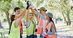 Volunteer, people and high five with celebration at park for goal, smile or stop pollution in summer. Friends, team building and happy for social responsibility, success or excited for sustainability