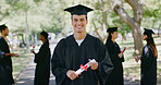 Happy, graduation and portrait of man outdoor for education, achievement and college degree. University, student and person with certificate for academic success, celebration and school milestone