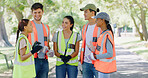 Group, people and volunteer in meeting at park for planning with discussion, speech or smile for accountability. Team, men and women for talk, happy and info for call to action for sustainability