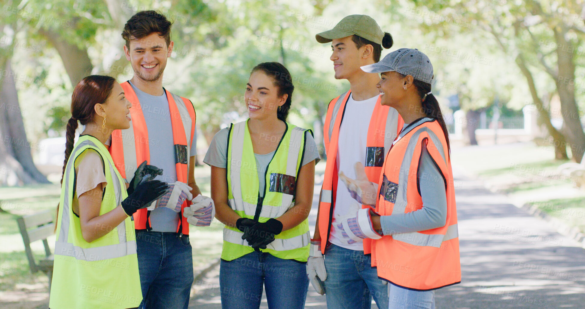 Buy stock photo Group, people and volunteer in meeting at park for planning with discussion, speech or smile for accountability. Team, men and women for talk, happy and info for call to action for sustainability
