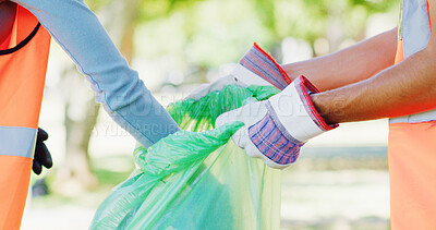 Buy stock photo Volunteer, park and hands of people with bag to collect trash, plastic and litter for pollution. Earth day, cleaning and person with team for community service, recycling and conservation outdoor