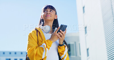 Buy stock photo Phone, thinking and walking with teen girl in city for commute to high school destination. App, headphones and inspiration with student outdoor in urban town for education, learning or study