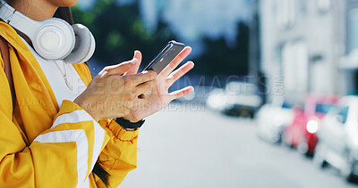 Buy stock photo Digital, phone and hands in city with scroll, social media update or message reply on commute. Space, connectivity or girl in urban area with technology, app browse or online chatting on outdoor walk