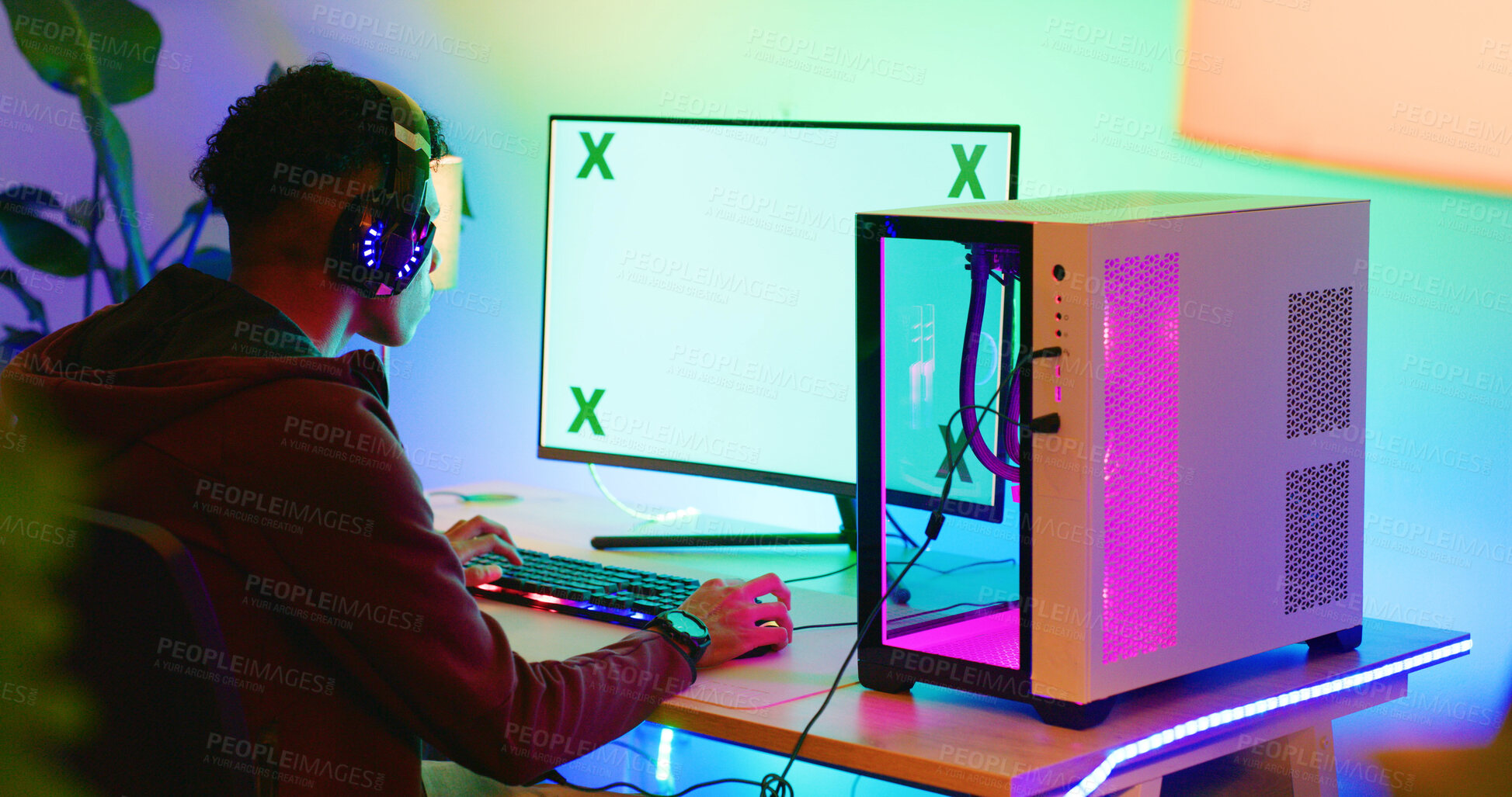 Buy stock photo Gamer, computer screen and teen with headphones in home for esports competition, action and back. Headset, boy and gaming monitor for gameplay challenge, online match or mockup space with neon light