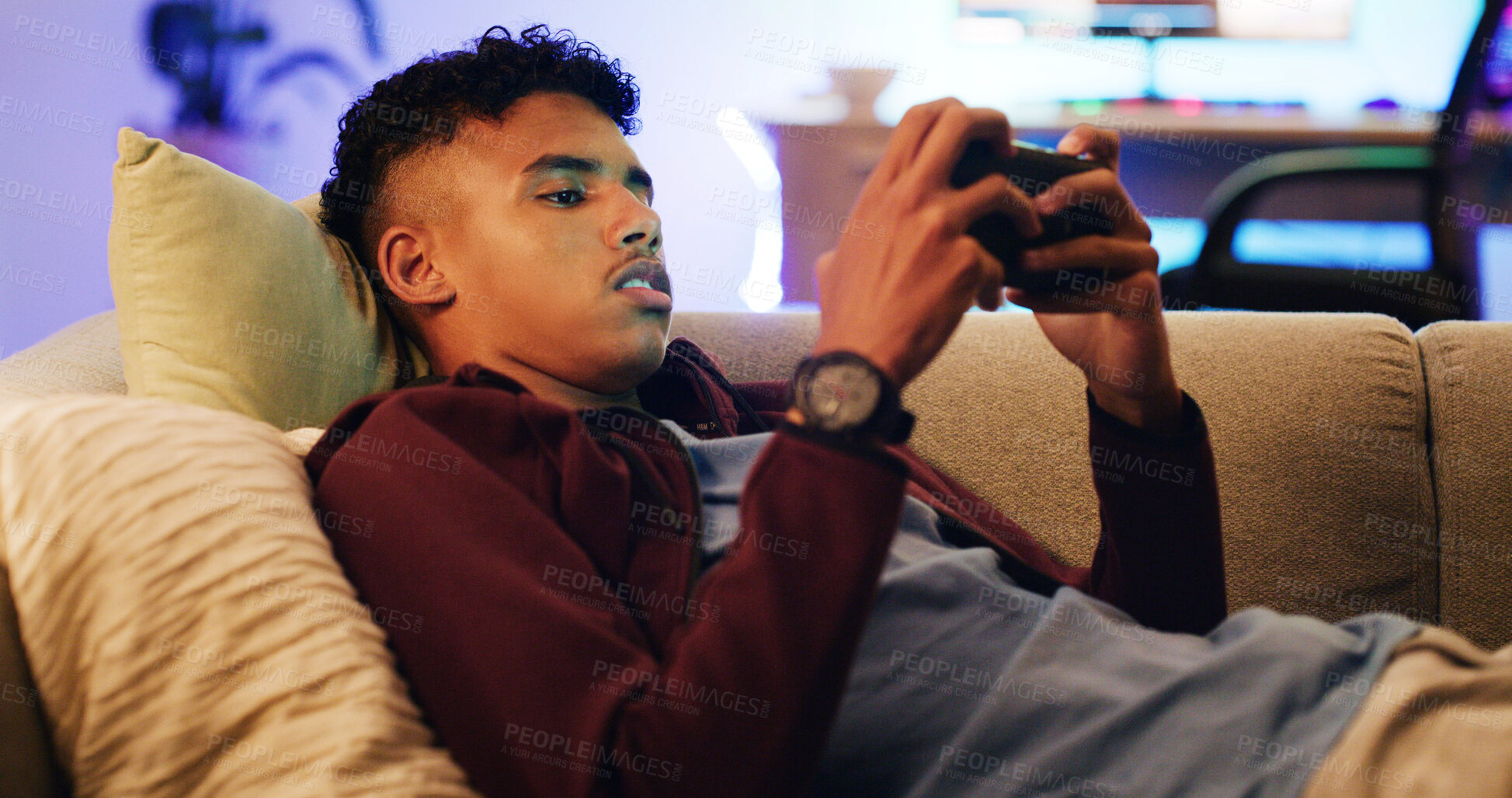 Buy stock photo Relax, cellphone gaming and teenage boy on sofa, typing and video streaming in living room. Home, contest and player on couch, smartphone and digital app for online score, internet and entertainment