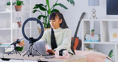 Buy stock photo Woman, laptop and influencer with typing, home and guitar teacher with video editing for content creation. Person, computer and recording tech for web show, podcast or music tutorial on social media
