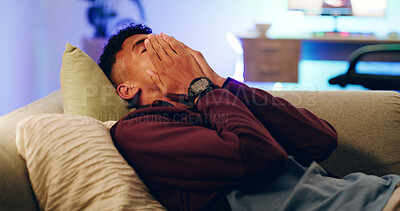 Buy stock photo Frustrated, tired and teenager on sofa at night with exhausted, upset and mad for gaming loss. Home, apartment and person on couch annoyed for losing, mistake and fail for video games in dark