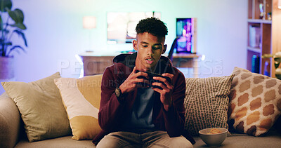 Buy stock photo Home, smartphone gaming and teenage boy on couch, contest and streaming in lounge. Relax, watching video and player on sofa, cellphone and digital app for online score, network and competition