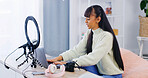 Girl, laptop and influencer with typing, home and post schedule with video editing for content creation. Person, computer and recording tech for web show, podcast or live streaming on social media
