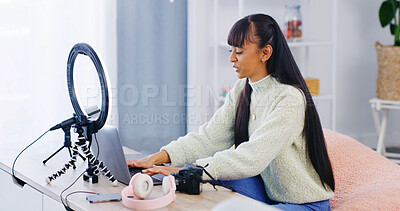 Buy stock photo Girl, laptop and influencer with typing, home and post schedule with video editing for content creation. Person, computer and recording tech for web show, podcast or live streaming on social media